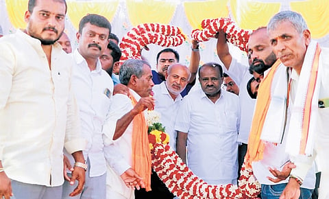 Union Minister for Heavy Industries and Steel HD Kumaraswamy being felicitated at a programme in Agrahara village of KR Nagar in Mysuru district on Friday