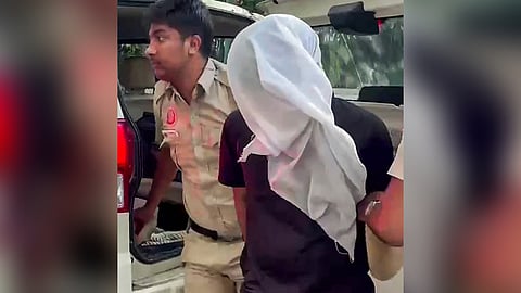 Accused Rahul Meena being brought to Amar Colony Police Station in the Indian Revenue Service (IRS) officer’s daughter murder case in Delhi, in New Delhi on Thursday.