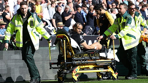 Tottenham Hotspur's Xavi Simons is taken off on a stretcher during the EPL football match between Wolverhampton Wanderers and Tottenham Hotspur at the Molineux stadium in Wolverhampton, central England on April 25, 2026.