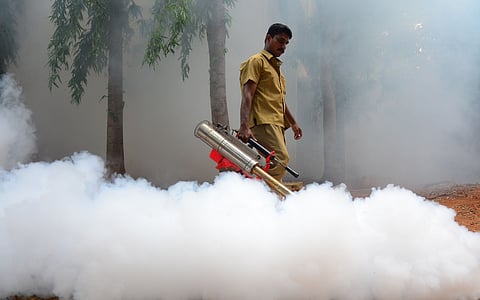 The officials are seen carrying out fogging activities to prevent mosquito breeding in Sivaganga.