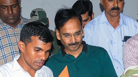 Jharkhand IAS officer Vinay Kumar Choubey (C) after being produced at a special court following his arrest by the Anti-Corruption Bureau (ACB) in a money laundering case linked to the alleged excise scam in the state, in Ranchi, Tuesday, May 20, 2025.