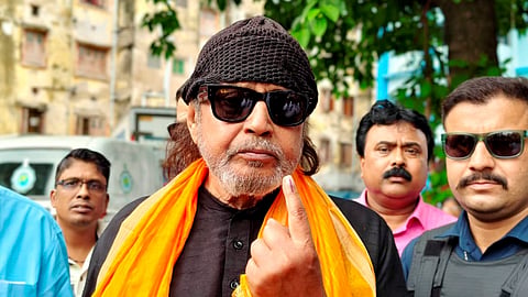 BJP leader Mithun Chakraborty shows his ink-marked finger after casting his vote during the second phase of the West Bengal Assembly elections in Kolkata, Wednesday, April 29, 2026.