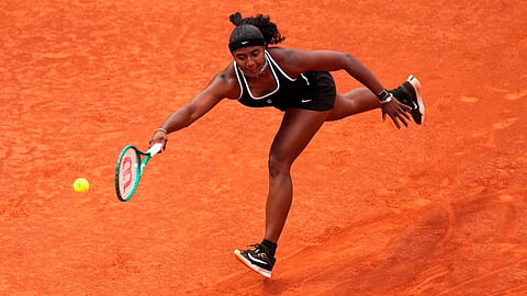 Hailey Baptiste, of the United States, reaches for a shot against Aryna Sabalenka, of Belarus, during the Madrid Open tennis tournament in Madrid, Tuesday, April 28, 2026.