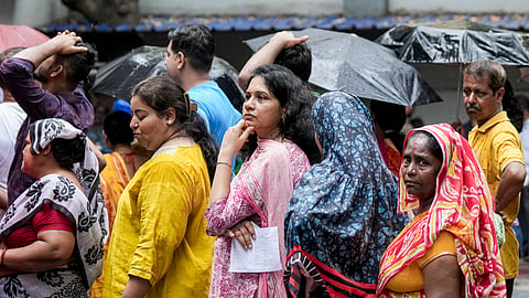 Voters wait in a queue to cast their votes during the second phase of the West Bengal Assembly elections in Kolkata on Wednesday, April 29, 2026.