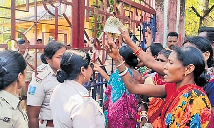 People staging a protest in front of the police station at Dabugaon on Wednesday