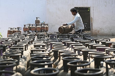A Worker at a LPG Cylinder station in New Delhi on Friday, May 1, 2026 after commercial LPG price was hiked by Rs 993.