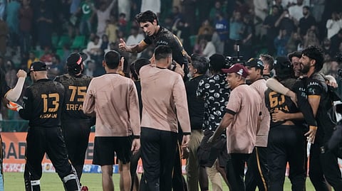 Hyderabad Kingsmen Hunain Shah, top center, celebrates with teammates after their team won the Pakistan Super League second eliminator cricket match against Islamabad United, in Lahore, Pakistan, Friday, May 1, 2026.