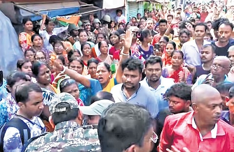 Local residents stage a protest in Falta, South 24-Parganas, on Saturday after being allegedly threatened and assaulted by a TMC leader.