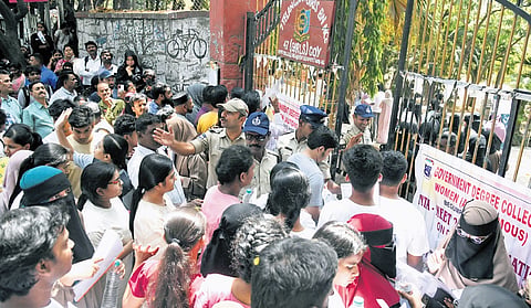 Students gather at an examination centre in Hyderabad as police manage entry during the NEET-UG examination on Sunday.