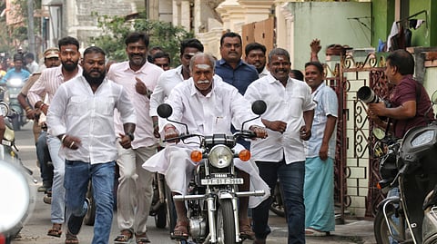 File | Puducherry Chief Minister N. Rangasamy arrives to the polling booth on his RX 100 bike to cast his vote in the Puducherry Assembly elections.