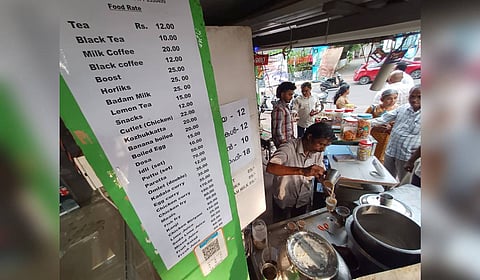 A small hotel near the Secretariat in Thiruvananthapuram puts up a revised price list, reflecting the hike in the cost of LPG cylinders.