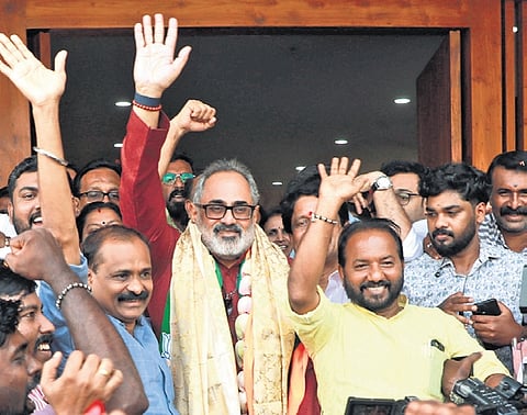 BJP state president Rajeev Chandrasekhar waves to supporters after winning the Nemom constituency in Thiruvananthapuram