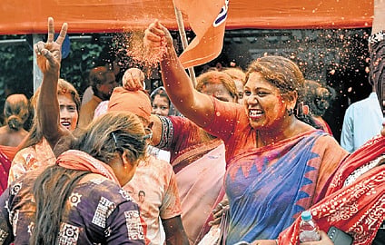 BJP workers celebrate after winning the elections in West Bengal.