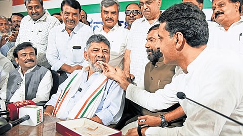 Congress leaders celebrate the party’s victory in the Bagalkot and Davanagere South Assembly bypolls at the KPCC office in Bengaluru on Monday.