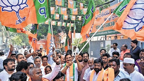 Union Minister B Srinivasa Varma and party cadre celebrate the BJP’s victory in Assembly polls, at State party office in Vijayawada on Monday,.