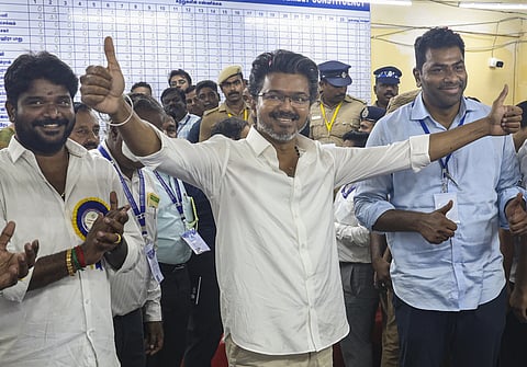 Tamilaga Vettri Kazhagam (TVK) chief and candidate from the Perambur constituency, Vijay, celebrates after winning in the Tamil Nadu Assembly election