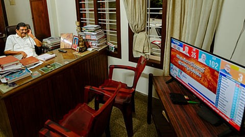 Kerala Congress (J) chairman and Thodupuzha MLA P J Joseph watches the election results on television at his Purappuzha residence on