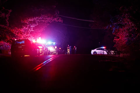 Police block off near S.Air Depot boulevard in Edmond, Okla, after a campground shooting at Lake Arcadia, May 3, 2026.