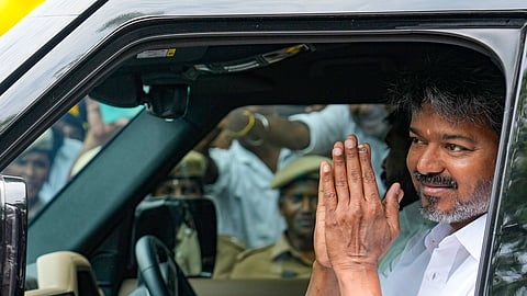 Tamilaga Vettri Kazhagam (TVK) chief Vijay greets as he arrives at the party headquarters after he wins the Tamil Nadu Assembly elections, at Panaiyur, in Chennai, Tuesday, May 05, 2026.