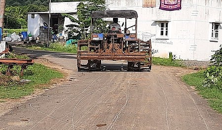A file picture of a tractor equipped with cage wheel on a road near Dharmapuri.