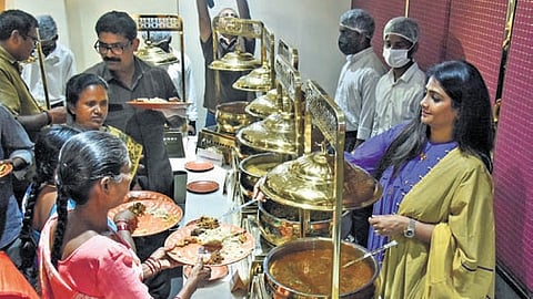 Food being served to sanitation workers to mark the fifth anniversary of UTK in Vijayawada on Wednesday.