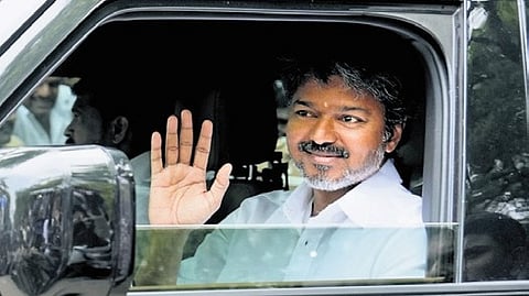 TVK president Vijay arrives at the party headquarters in Chennai.