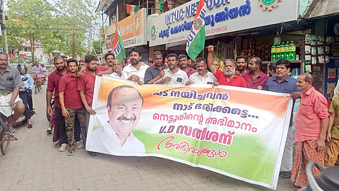 INTUC workers stage a demonstration in Nettoor, Kochi, in support of Congress leader V D Satheesan in the battle for the post of chief minister.