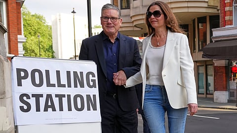 Britain's Prime Minister Keir Starmer and wife Victoria arrive at a polling station in central London, Thursday, May 7, 2026 to cast their votes in the local elections.