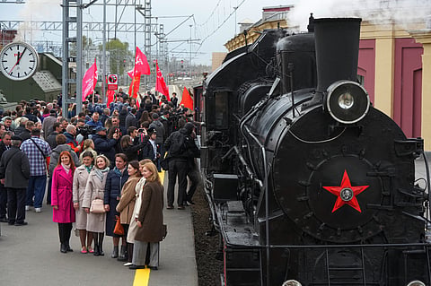 People gather on a station platform during a historical reenactment depicting the arrival of trains after the end of the war as a part of celebrations ahead of the 81st anniversary of the Soviet Union's victory over Nazi Germany during World War II, at the Baltiysky railway station in St. Petersburg, Russia, Thursday, May 7, 2026.