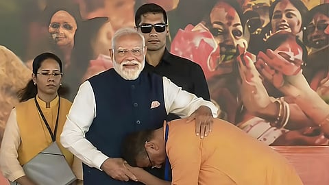 BJP leader Chief Minister Suvendu Adhikari (R) with Prime Minister Narendra Modi after the former took oath as the West Bengal Chief Minister in Kolkata on Saturday.
