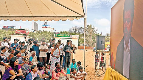 Members of the public watch live streaming of the oath-taking ceremony at Elliots Beach.