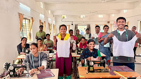 Surrendered Maoists getting lessons on tailoring.