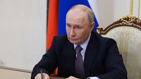 In this pool photograph distributed by the Russian state agency Sputnik, Russia's President Vladimir Putin chairs a Security Council meeting via videolink in Moscow on May 8, 2026.