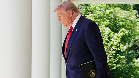 President Donald Trump walks through the Colonnade at the White House as he heads to the Rose Garden, Friday, May 8, 2026, in Washington.
