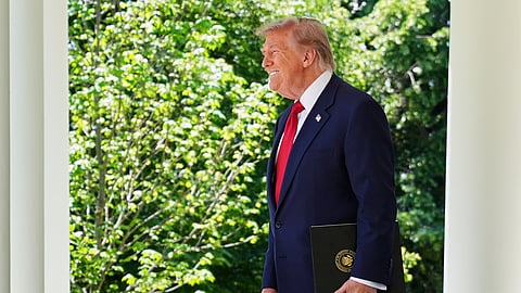 US President Donald Trump walks through the Colonnade at the White House as he heads to the Rose Garden, Friday, May 8, 2026, in Washington.