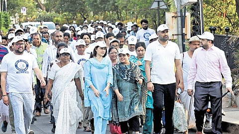 Senior officials lead the Census awareness walkathon at Necklace Road in Hyderabad on Monday.
