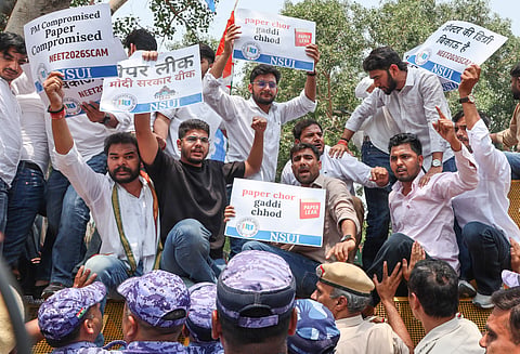 National Students' Union of India (NSUI) members stage a demonstration against the National Testing Agency (NTA) over alleged paper leak concerns following the cancellation of the NEET-UG 2026 examination, outside Shastri Bhawan, in New Delhi, Tuesday, May 12, 2026.