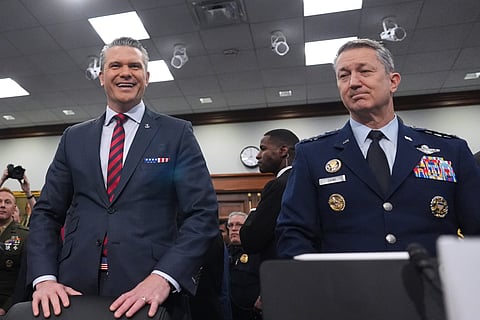 Defense Secretary Pete Hegseth and Chairman of the Joint Chiefs of Staff Gen. Dan Caine arrive to testify at a House Appropriations subcommittee budget hearing for the Department of Defense, Tuesday, in Washington.