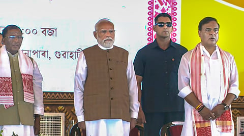 Prime Minister Narendra Modi, Assam Governor Lakshman Prasad Acharya, state Chief Minister-designate Himanta Biswa Sarma during the swearing-in ceremony of the state government, at Khanapara in Guwahati, Tuesday, May 12, 2026.