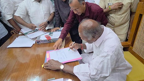 Chief Minister N Rangasamy signing files in presence of Chief Secretary Sharath Chauhan at his chamber on Wednesday.