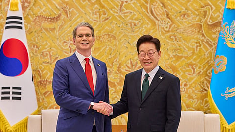 This handout photo taken on May 13, 2026 and released by the Blue House via Yonhap shows South Korean President Lee Jae Myung (R) shaking hands with US Treasury Secretary Scott Bessent (L) during their meeting at the presidential Blue House in Seoul.