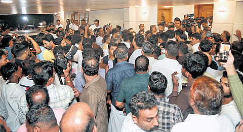 Congress workers raising slogans in support of V D Satheesan at his residence in Aluva on Wednesday.