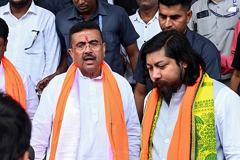 West Bengal Chief Minister Suvendu Adhikari with state Cabinet Minister Nisith Pramanik after the oath-taking ceremony of the newly-elected MLAs in the state Legislative Assembly, in Kolkata, Wednesday, May 13, 2026.