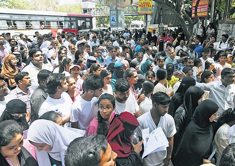 A file photo of students waiting outside Government Degree College for Women in Hyderabad before appearing for NEET-UG 2026 on May 3