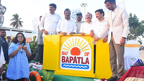 Ministers Kandula Durgesh and Anagani Satya Prasad launches Bay of Bapatla branding logo at Suryalanka Beach on Tuesday.