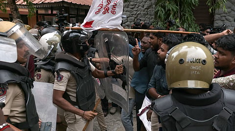 A scuffle breaks out between SFI activists and police personnel on the AG’s office premises in Thiruvananthapuram on Tuesday, during a protest against the alleged leak of the NEET-UG examination question paper.