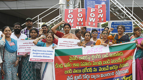 Members of a women's organisation stage a protest at the Ambedkar Statue in Hyderabad, demanding the arrest of Bandi Bageradh in connection with a POCSO case, on Wednesday.