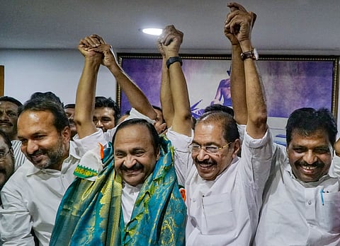 Congress leader VD Satheesan joins hands with KPCC President Sunny Joseph and other party leaders after the former was announced as the next Chief Minister of Kerala, at KPCC office, in Thiruvananthapuram, Thursday, May 14, 2026.