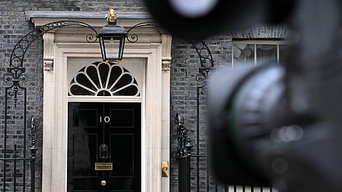 A TV camera points at the door of 10 Downing Street in London, Thursday, May 14, 2026, as efforts to unseat British Prime Minister Keir Starmer are likely to break out into open rebellion on Thursday.