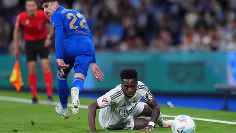 Real Madrid's Vinicius Junior, right, and Real Oviedo's Nacho Vidal challenge for the ball during the Spanish La Liga soccer match between Real Madrid and Real Oviedo in Madrid, Spain, Thursday, May 14, 2026.
